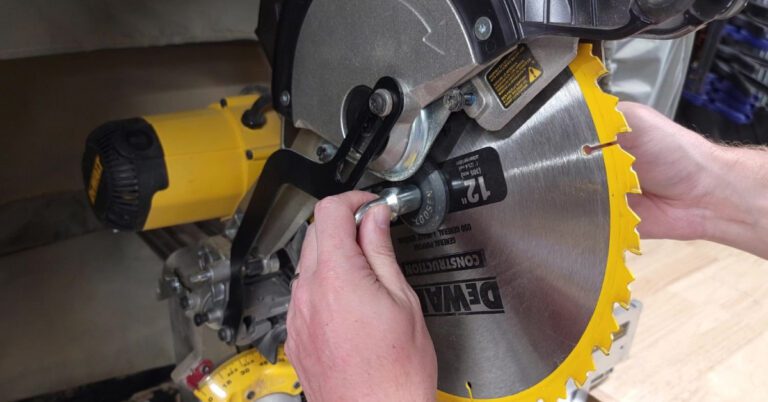 close up of a miter saw blade being take off